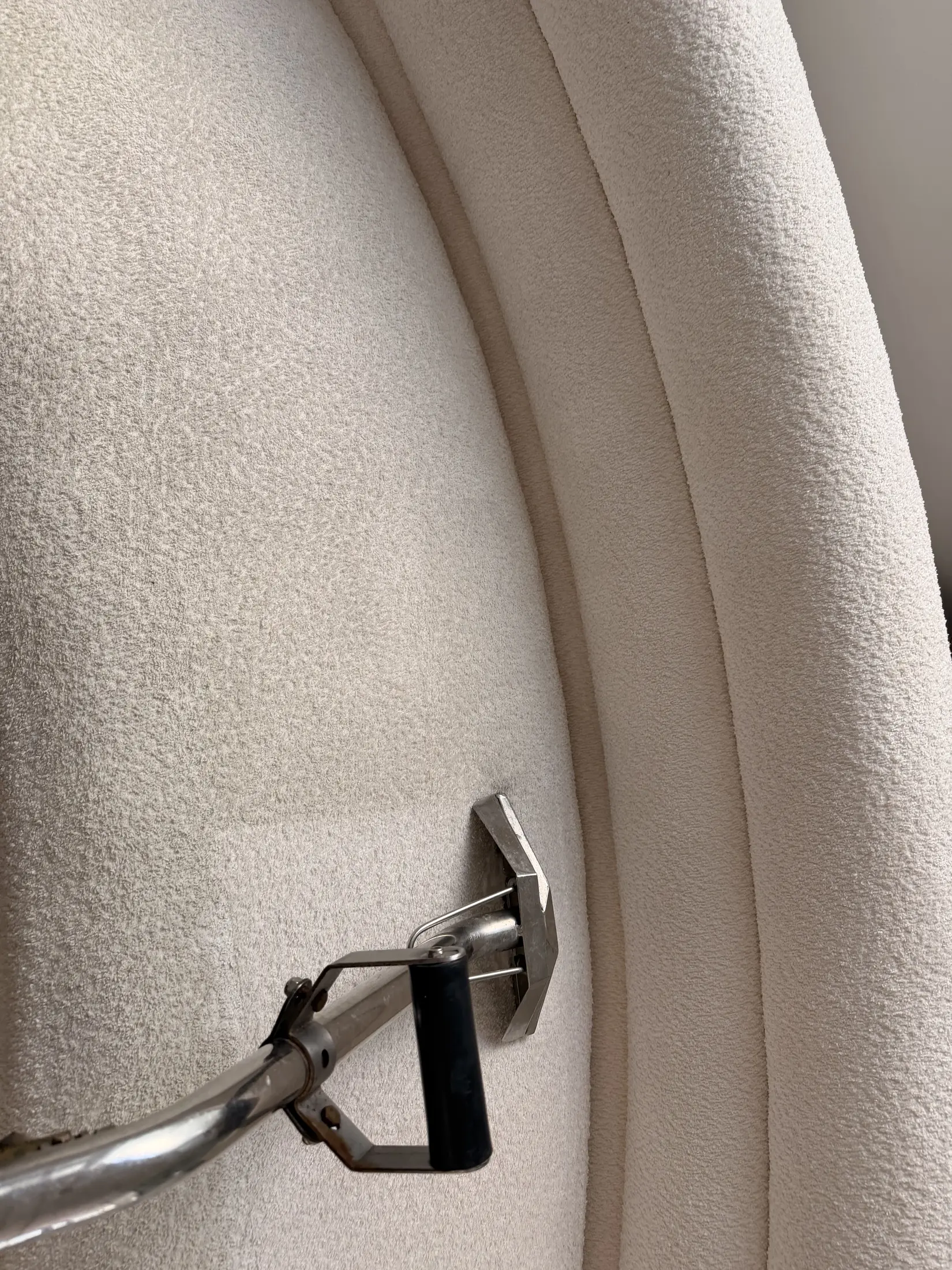 Professional mattress cleaning with an extraction tool in Orange County